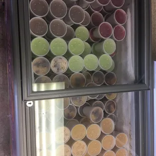a refrigerator full of cups