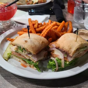 a sandwich and fries on a plate