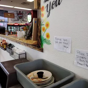you pick up your food at the counter, and bus your own trays