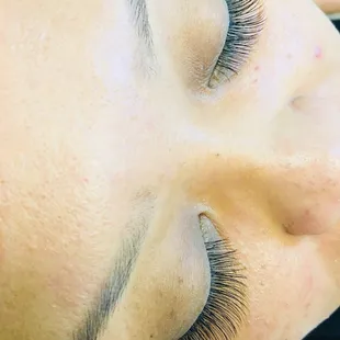 Eye lash extension- medium length set- very natural looking and has a light feeling.