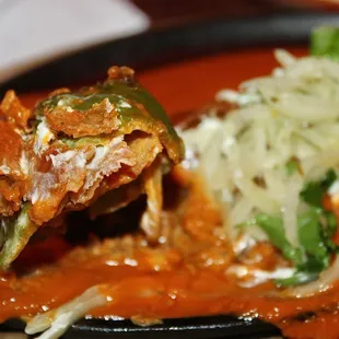 The fried pepper was stuffed with loads of melted ooey-gooey cheese and lightly spiced chorizo. The pickled white onion added a crisp tang.