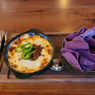 Queso w/chorizo &amp; blue corn tortilla chips.