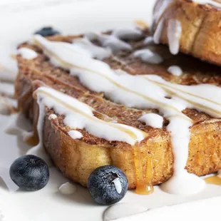 a plate of french toast with blueberries
