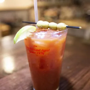  bloody drink with a lime garnish