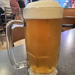 Large beer with a full head of foam.