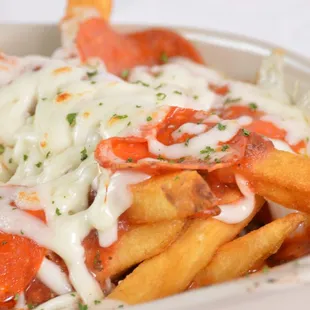 a close up of a bowl of fries