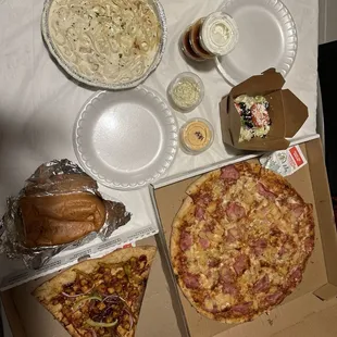 Hawaiian pizza and chicken Alfredo and the New York slice pizza barbecue chicken no pizza two big garlic bread, toasted, and salad