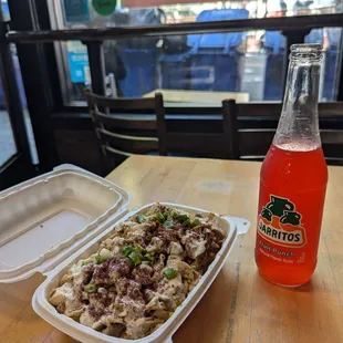 Half and half chicken plus a fruit punch jarrito from beverage cooler