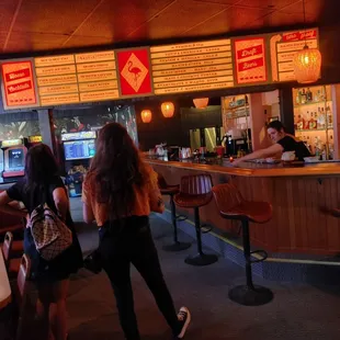 ows a group of people in a restaurant