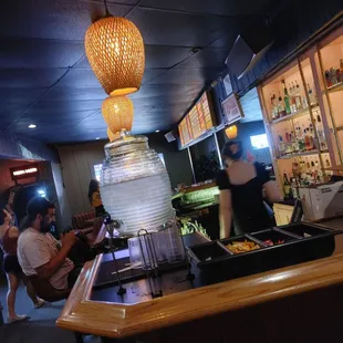 ows a group of people in a restaurant