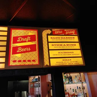 ows a sign above a bar