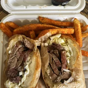 Brisket sandwich with seasoned fries