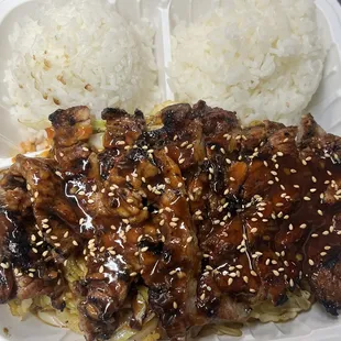 Marinated pork tenderloin.  Came with rice, stir fry noodles, and side salad 15.99