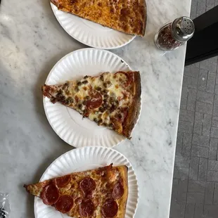 Cheese pizza, sausage and pepperoni pizza and pepperoni pizza
