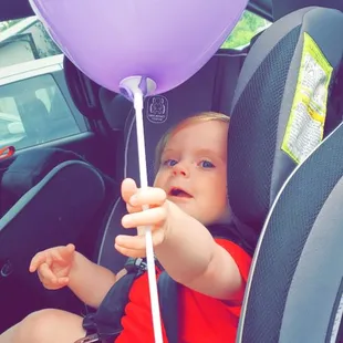 A purple balloon from My Pediatric Dentist, for being such a big girl at my check up!