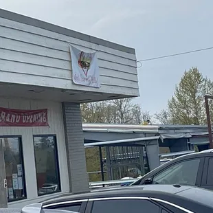 a car parked in front of a restaurant