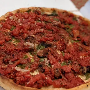 Large deep dish with garlic sausage and spinach