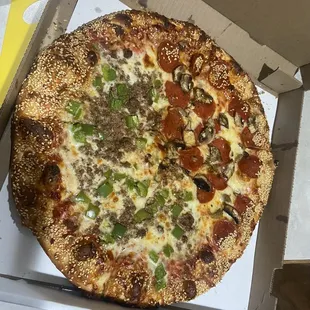 Large round half pep half mushroom half green pep half ground beef.