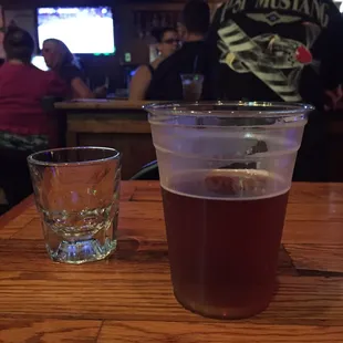 a cup of beer and a shot of whiskey