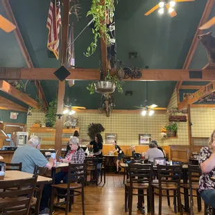 People enjoying the food, very well decor.