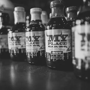 ows a row of liquor bottles