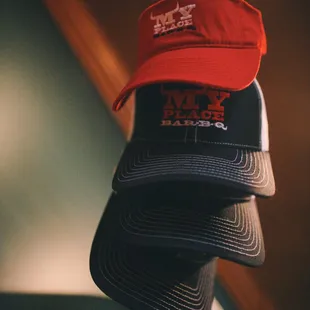 ows a hat hanging on a bar