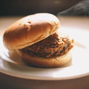 ows a meat sandwich on a bun