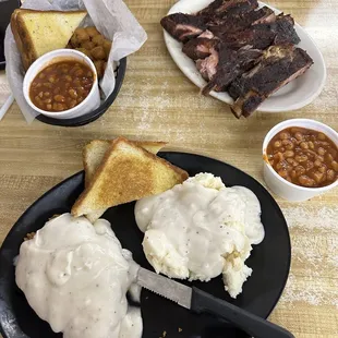 Fried okra, Texas toast, baked beans and ribs and on bottom the chicken fried chicken dinner