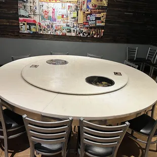 Large round table in a semi-private room, could seat 12.