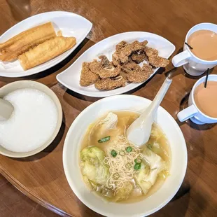 Plain congee and fritters; Noodle soup with pork cutlets; Hong Kong style milk tea