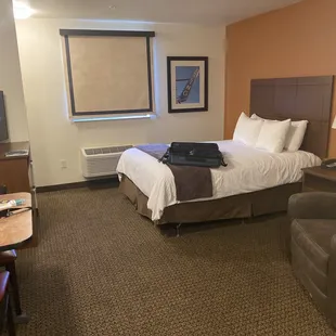 Spacious room with table and recliner