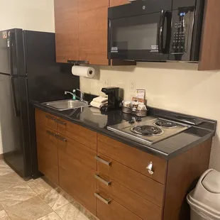 Mini kitchen with full size refrigerator. Nice