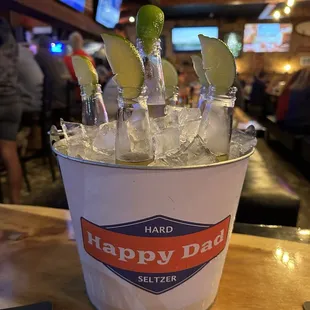 a bucket of ice and limes