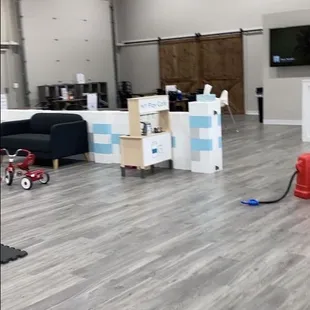 a room with a fire hydrant and a television