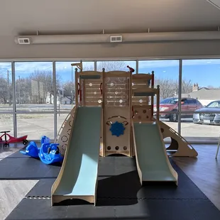 a play area with a slide