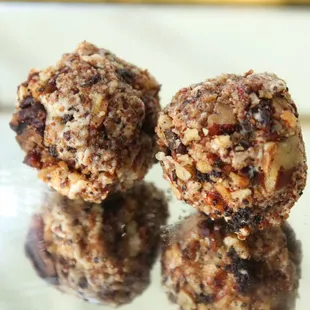 A Bit of Southern Charm Truffle- Grand Marnier™ dark chocolate Ganache, coated in white chocolate and a toasted pecan crumble.