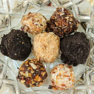 Sampling of artisan truffles made with love and coating with toppings.