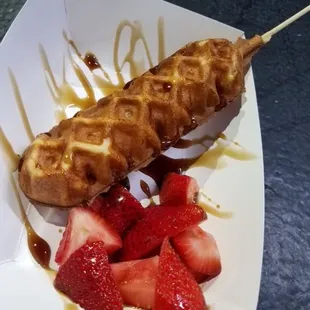 Chicken and waffle. Chicken sausage with waffle baked around it