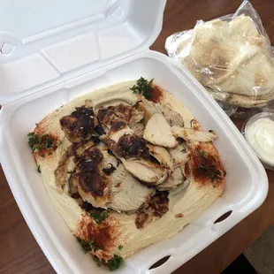 The best place to eat healthy and delicious, this is what i got for lunch today hummus with chicken and i loved it .