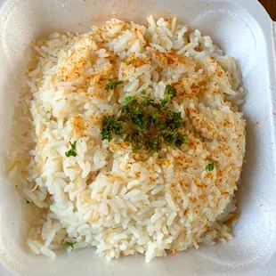 a rice dish in a styrofoam container