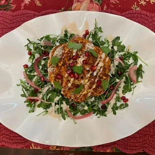 Shwarma Spiced Whole Roasted Cauliflower with Herb Lentil Salad, Quick-Pickled Red Onions, Lemony Tahini Sauce and Spicy Schug Sauce
