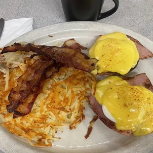 Eggs Benedict plus hash browns and bacon