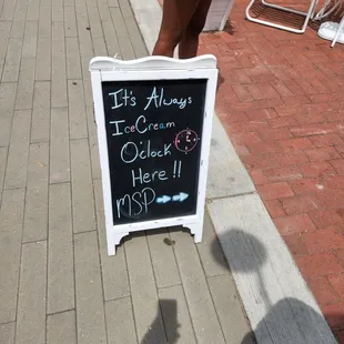 a sign on the sidewalk