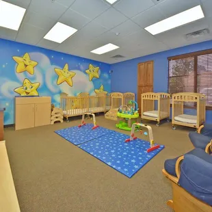 One of My Small Wonder&apos;s infant rooms. Beautiful painted walls and individual assigned cribs.