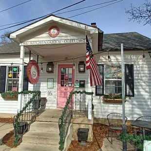 the front of a small white house