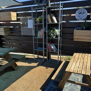 a patio with a table and a fan