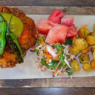 Burqueno Hot Chicken Plate  $12.00 Red &amp; Green chili seasoned fried chicken. Watermelon, fried okra,  house slaw garnished with chared shis