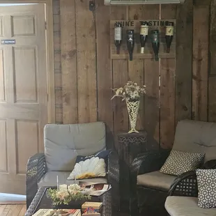 a living room with wood paneling