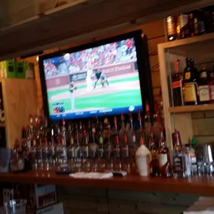 a man watching a baseball game on tv