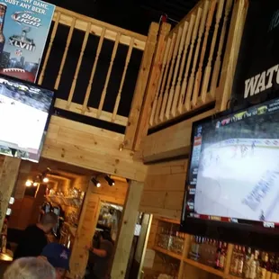 people watching a hockey game on tv